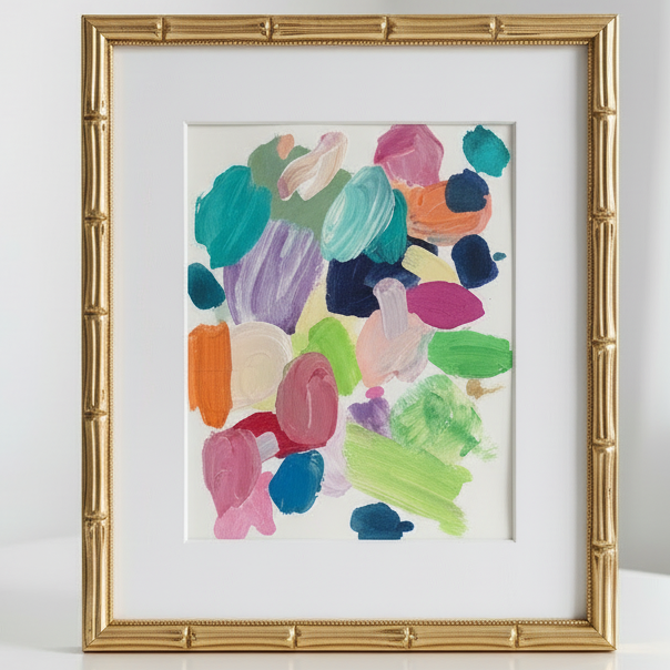 Framed abstract art with colorful brush strokes on a white background
