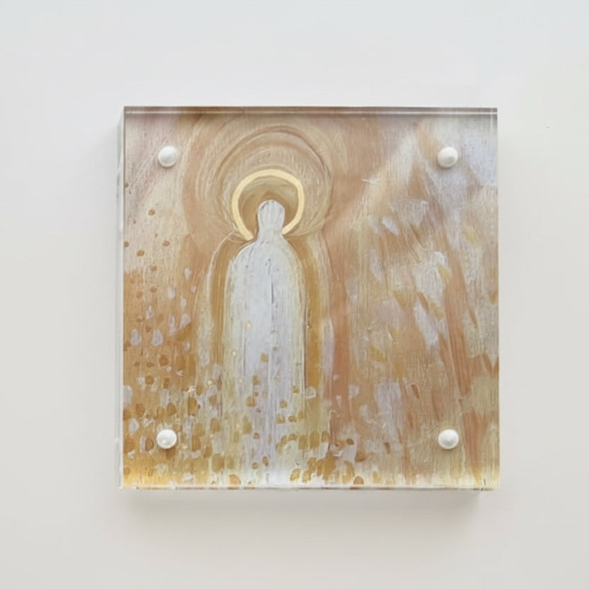 A small square clear acrylic frame with a white and gold abstract painted angel by Phoenix artist Julie Hamilton