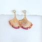 Gold fan earrings with coral and pink beads on a white background by artist Julie Hamilton 