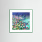 green Framed artwork of a colorful floral scene on a white wall