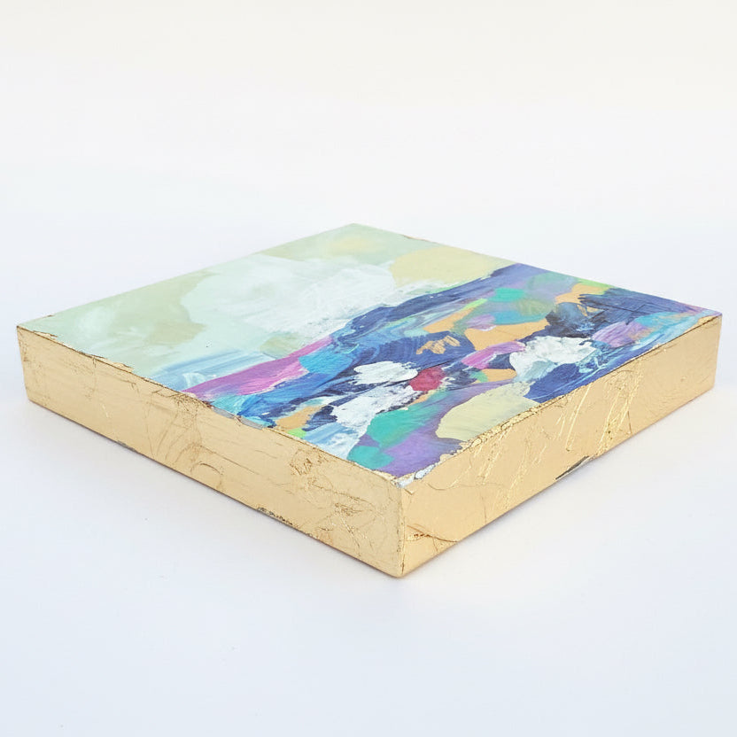 A small colorful abstract landscape painting with gold leaf edges by phoenix artist Julie Hamilton