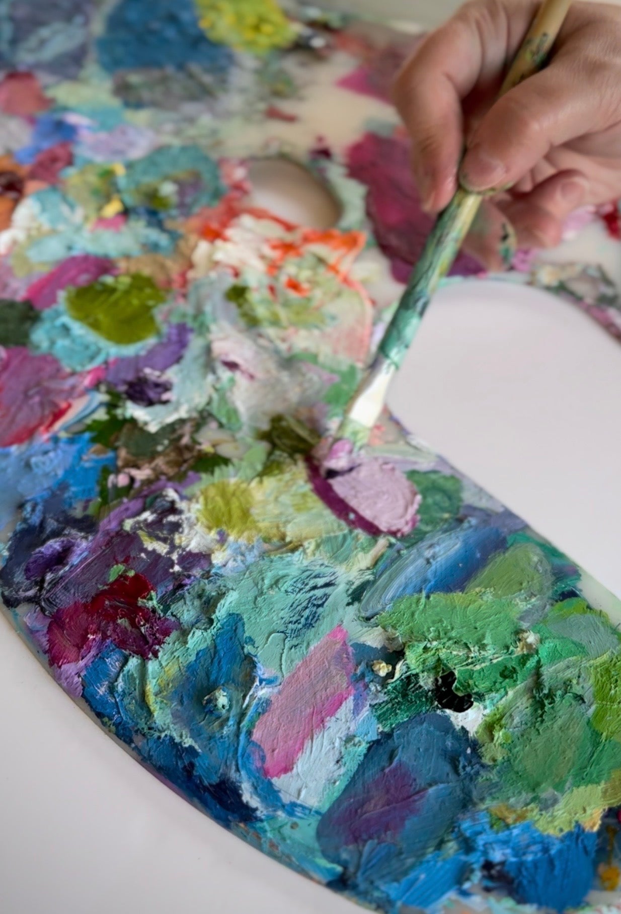 Julie Hamilton’s very colorful oil painting palette in her Phoenix AZ Art studio