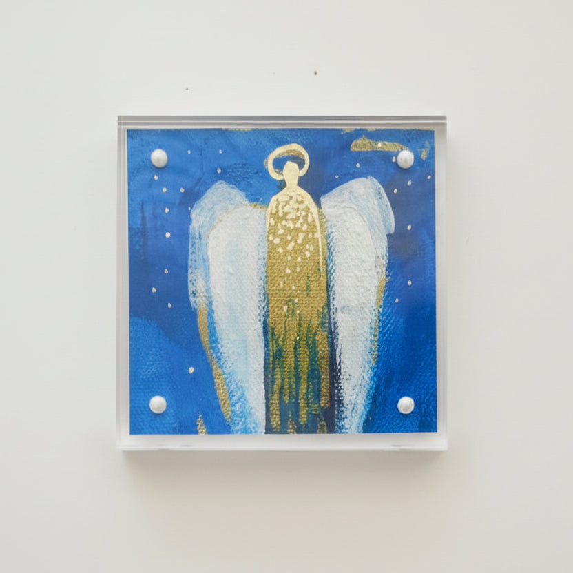 Clear acrylic Framed artwork of an abstract angel in blue, gold, and white with a blue starry night sky background