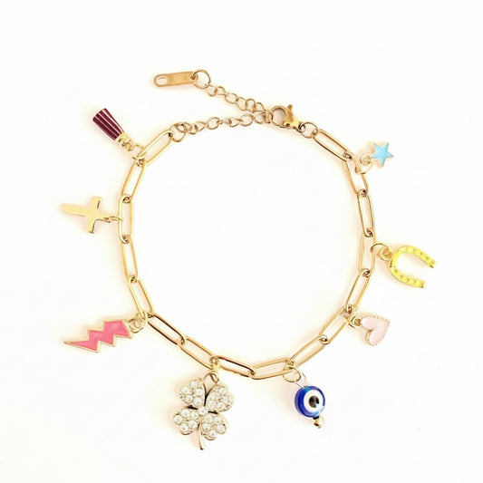 Gold bracelet with various lucky charms on a white background