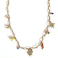 Necklace with various lucky charms on a white background
