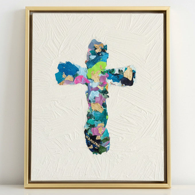 Colorful cross-shaped collage art on a textured white canvas with gold leaf on a white background