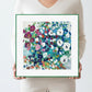Framed art print with colorful floral pattern on a white background