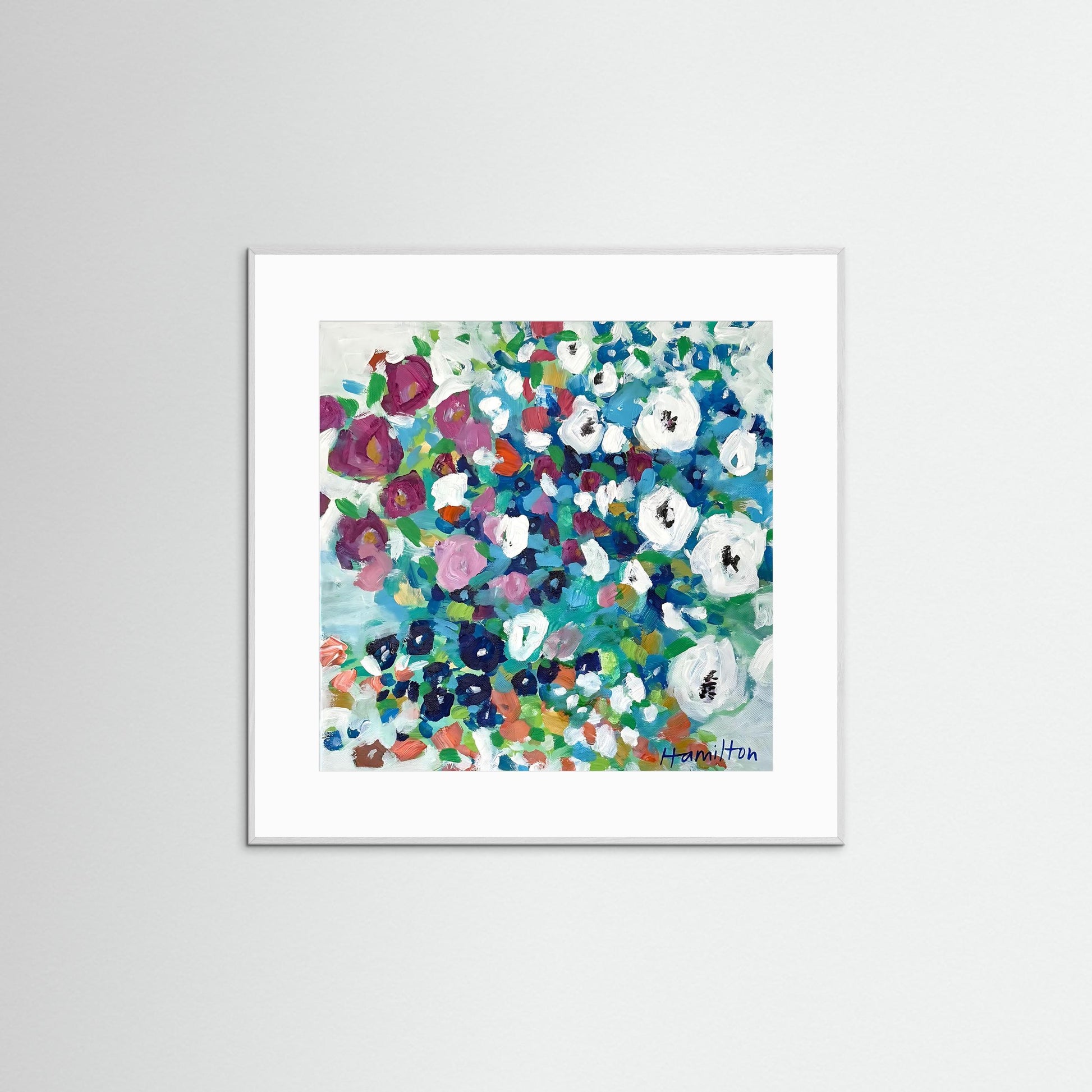 Framed floral art print with colorful flowers on a white background