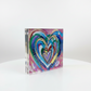 Colorful heart-shaped card with a white border on a white background