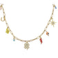 Gold chain necklace with various lucky charms on a white background