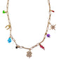 Gold chain necklace with various charms on a white background