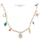 Gold chain necklace with various lucky charms on a white background, featuring the brand 'Julie Hamilton Art'.