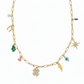 Gold chain necklace with various lucky charms on a white background