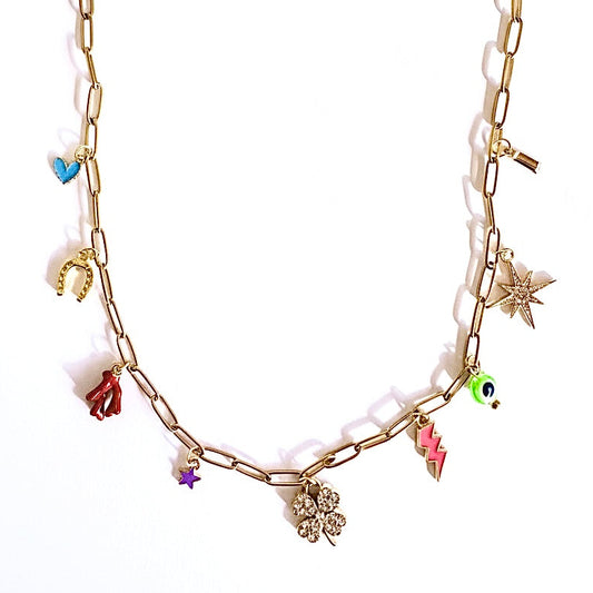 Gold chain charm necklace with various lucky charms on a white background