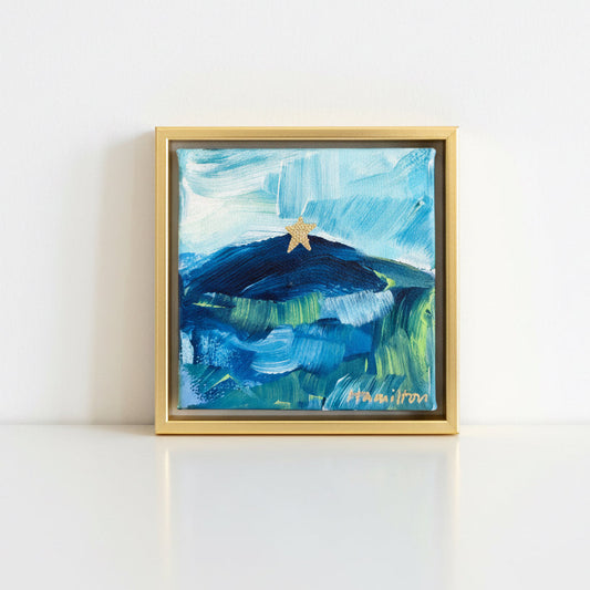 Small abstract painting of mill mountain star on a white table signed by Hamilton
