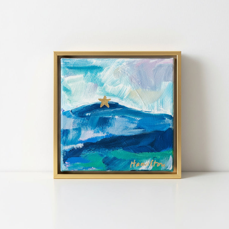 Framed abstract landscape painting of mill mountain star on a white surface
