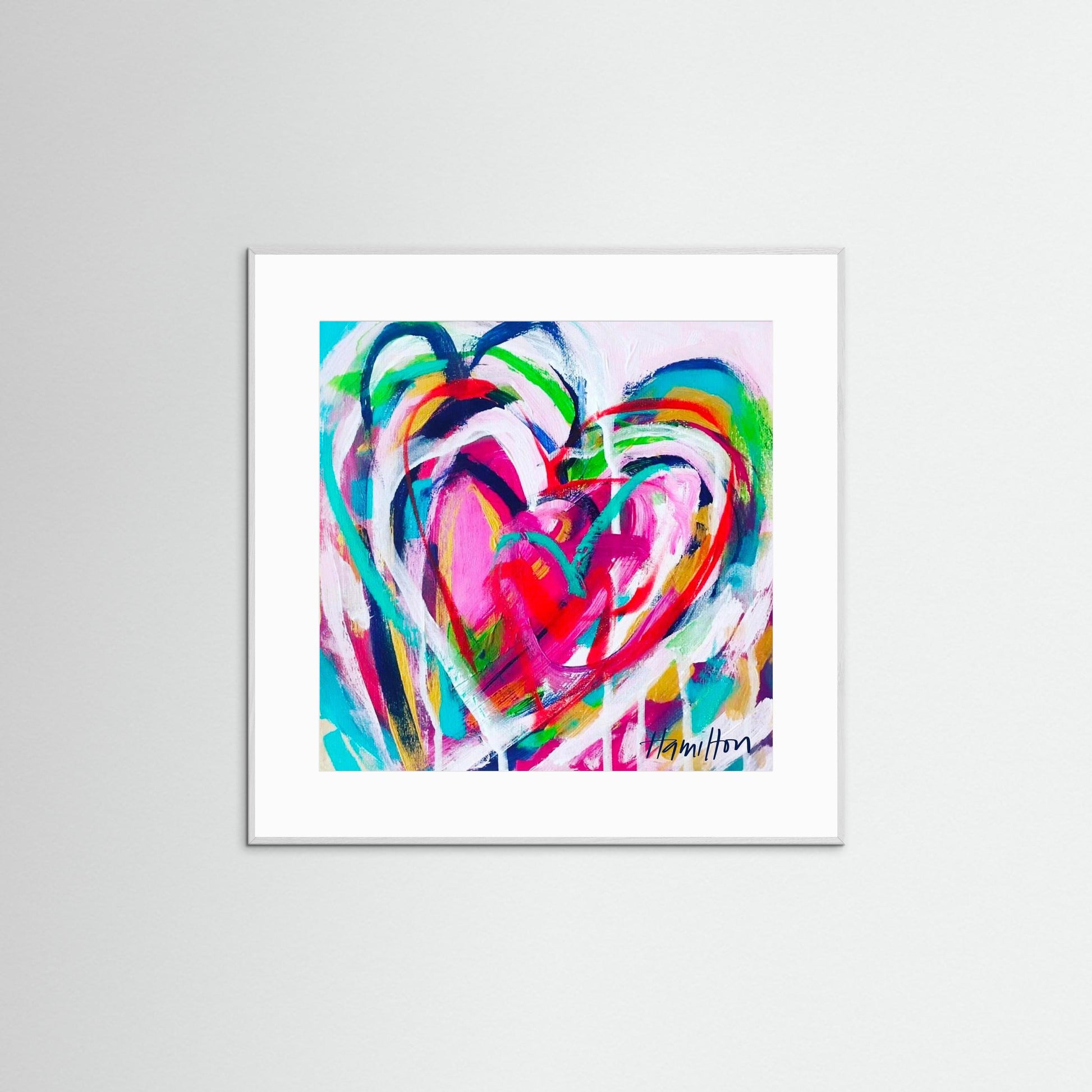 Colorful abstract heart artwork in a white frame on a light gray background