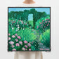 Person holding a painting of a garden with flowers and trees in a minimalistic setting