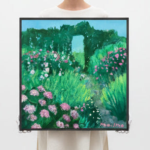 Person holding a painting of a garden with flowers and trees in a minimalistic setting